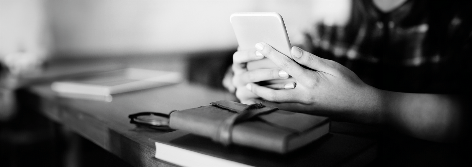 Contact Esther Writer banner holding phone